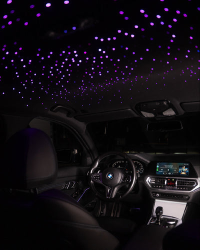 Car interior with starlight projection on the ceiling